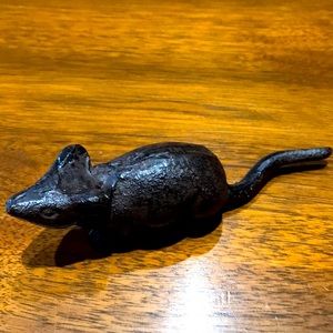 Wrought iron mouse for a cheese board.